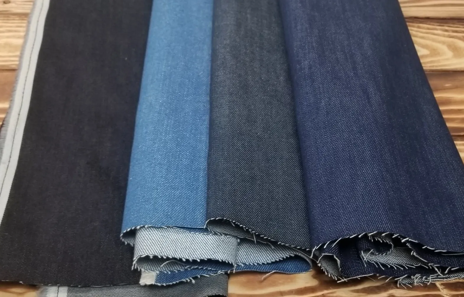 End of Bolt: 1-5/8th yards of Cone Mills Denim Vibrant Indigo Slight Stretch 11oz Pink Line Selvage Woven- remnant